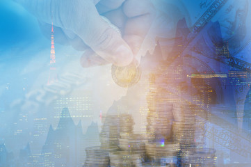 Double exposure money pile coins on trading graph and capital city background