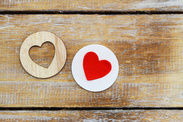 Two wooden hearts on rustic surface with copy space