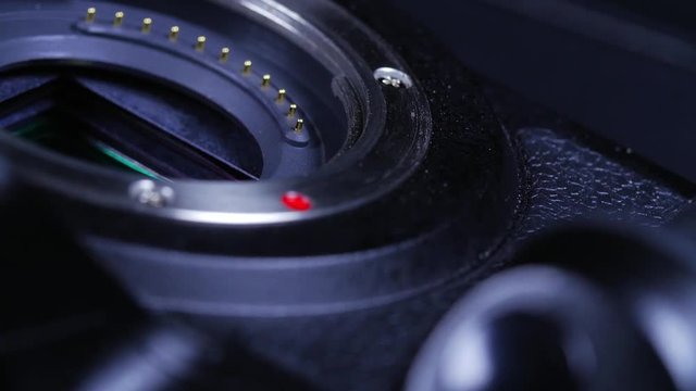 Macro closeup of dslr camera and sensor rotating around
