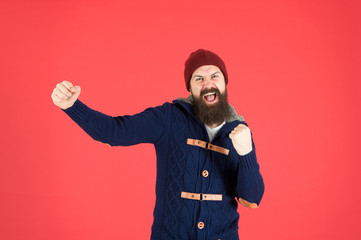 Fototapeta na wymiar Happiness. Man bearded hipster stylish fashionable jumper and hat. Emotional expression. Casual clothes for winter season. Hipster with long beard. Hipster lifestyle. Stylish outfit hat accessory