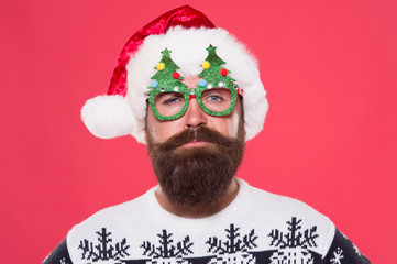 New year, new you. Bearded man wear christmas tree party glasses. Santa man with long beard and...