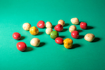 multi-colored sweets on a green background