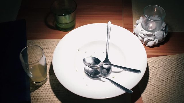 Spoons in a plate of three partners.