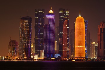 Obraz na płótnie Canvas Doha skyline at night with illuminated skyscrapers, Qatar