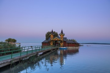 Fototapeta premium An island at sunset in Lake Balaton
