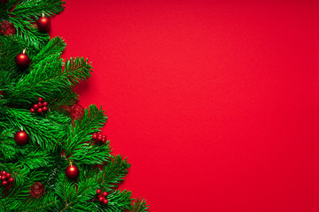 Red Merry Christmas Background with Fir branch an Baubles