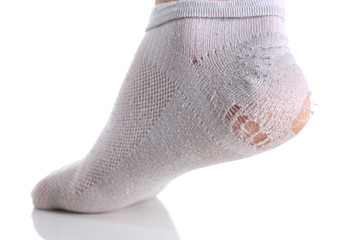 Ripped white sock on male leg isolated