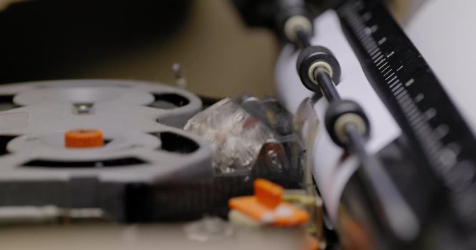 ECU ON THE BALL OF A VINTAGE ELECTRIC TYPEWRITER, IN USE.  SHALLOW DOF.  C4K, 10 BIT, ALL-INTRA CODEC