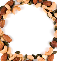 Frame made of different nuts on white background
