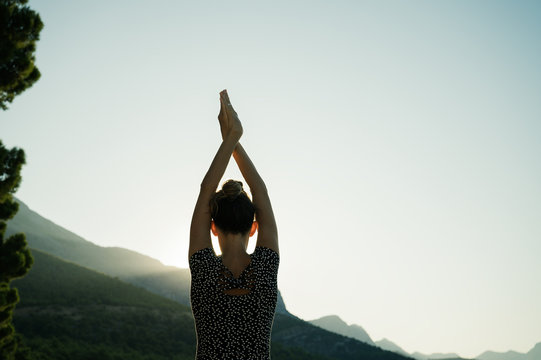 Young Woman Making Yoga Asana Outside