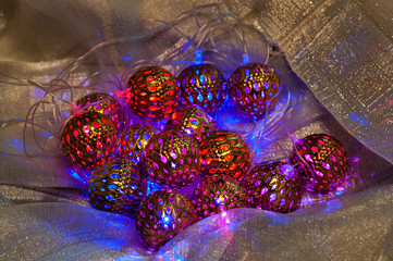 Christmas decorations - a decorative luminous garland in the form of colorful balls