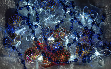 Christmas decorations - decorative luminous garlands in the form of balls and flowers and shiny beads