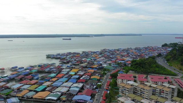 4K Aerial footage of local water village houses at Kg. Sim Sim water village Sandakan City, Sabah, Malaysia. Sandakan once known as Little Hong Kong of Borneo.