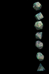 RPG set green dice for playing role playing games on black blackground.