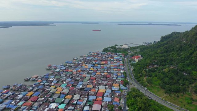 4K Aerial footage of local water village houses at Kg. Sim Sim water village Sandakan City, Sabah, Malaysia. Sandakan once known as Little Hong Kong of Borneo.