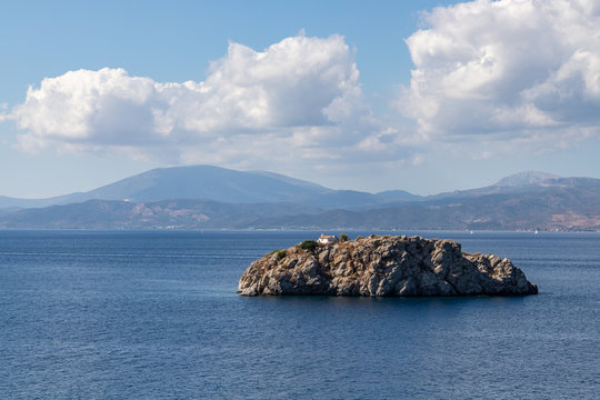 Church in a small island in front of  Vlychos Plakes Beach in Hydra Island