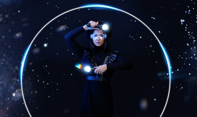 Naklejka premium Beautiful woman in futuristic dress over dark magic background. Gamer girl in glasses of virtual reality with controllers in hands. Augmented reality, game, hobby concept. VR. Blue neon light.
