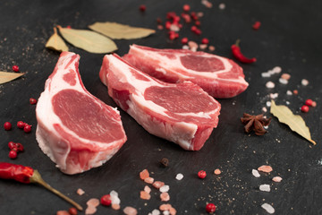 Raw Lamb Chops, Mutton Cuts or Sheep Ribs on Black