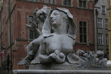 Fototapeta na wymiar Gdansk, Poland - 06/07/2019: Sculptures at the Neptune Fountain.