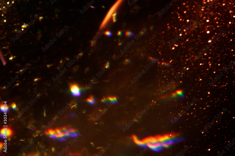 Poster Easy to add lens flare effects for overlay designs or screen blending mode to make high-quality images. Abstract sun burst, digital flare, iridescent glare over black background. Defocused dark bokeh.