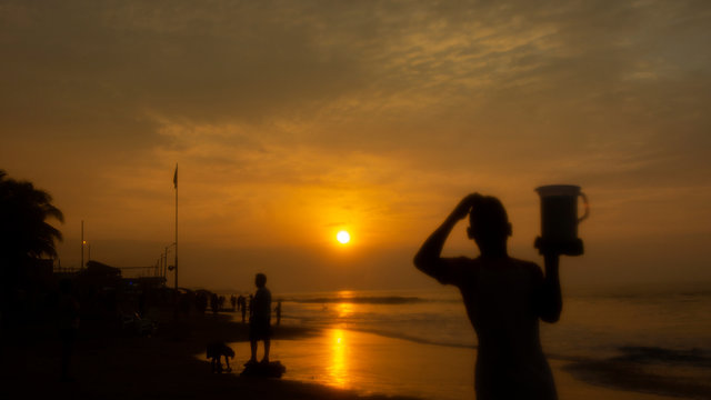 People walking on the beach of Tonsupa at sunset