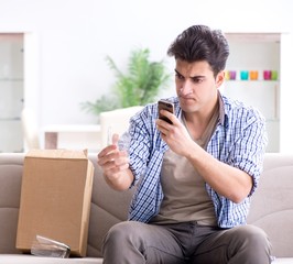 Man receiving wrong parcel with glasses