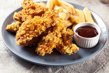 Chicken strips in cornflakes breadcrumb