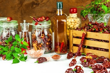 Harvest or chilli. Chili (Bhut Jolokia Chocolate) in a wooden crate. Preparation for drying. Spicy food. Sale of spices.