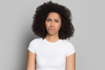 Head shot portrait offended upset African American girl feeling bad