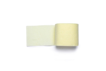 Roll of yellow toilet paper on a white background. Personal hygiene concept. Flat lay, top view