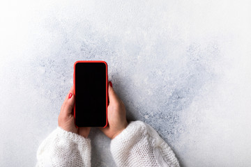 Mobile smartphone in woman's hand