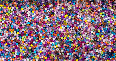 Fototapeta na wymiar Tiny multi coloured threading beads