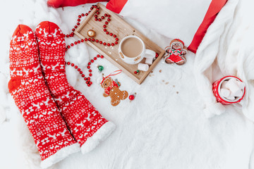 Flat lay Cozy winter holiday. Christmas background. Marshmallow and christmas decoration on a light background.