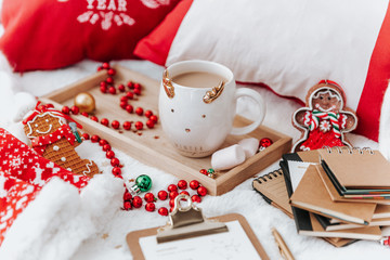 Christmas background. Coffee cup and christmas decoration on a light background, top view. Christmas still life