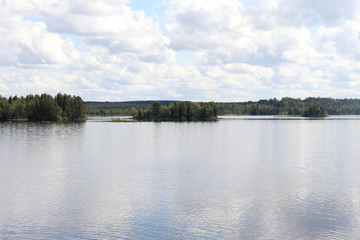 Lake Ranuanjarvi in Ranua, Finland with green trees in the background