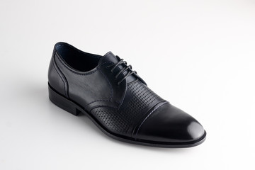 Black man leather shoe with shoelaces on white background