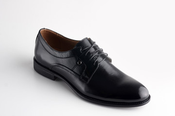 Black men leather shoe with shoelaces on white background