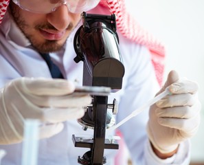 Arab chemist working in the lab office