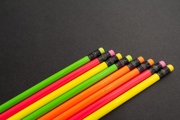 color pencils on black background