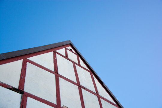 clean picture of a house roof in the blue sky