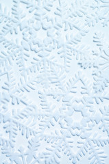 Icy blue snowflake pattern in festive full frame textured background