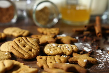 Christmas - gingerbreads - snowman, xmas ball on honey and sugar background