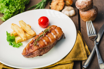 Roast duck breast with potato and boiled tomato