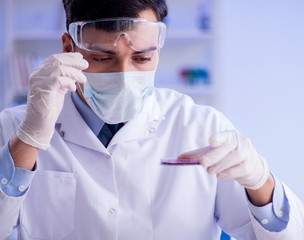 Lab assistant testing blood samples in hospital