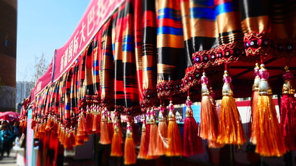 Fototapeta na wymiar red oriental blessing amulets, scrolls & talisman for fortune, love, luck & wealth 
