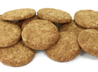 Round whole wheat biscuit, cookie with raisins isolated on white background. Biscuits with whole-wheat (wholemeal) flour isolated on white background 