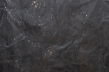 dark polyethylene texture with bruises and dust