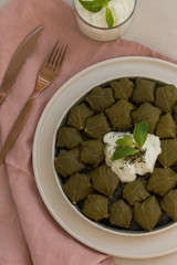 Upper view shot of staffed grape leaves. Minimalistic composition.