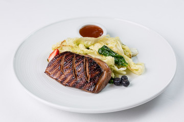 Grilled duck breast with vegatables and berry suase