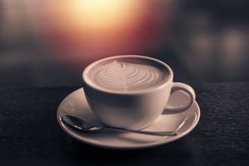 Close up latte art on table. vintage filter